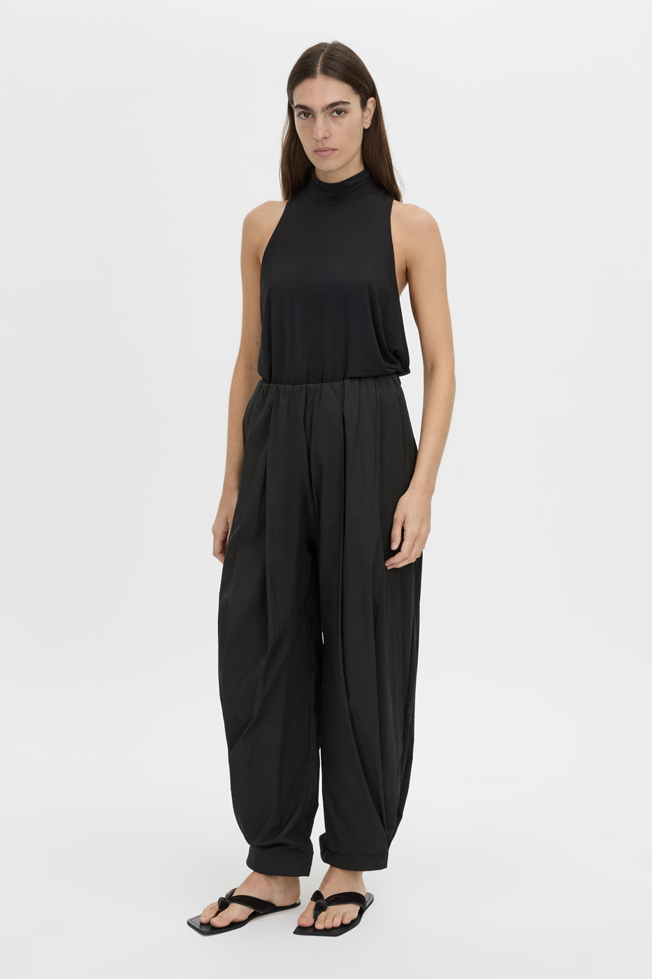 Front styled view CAMILLA AND MARC Valerie High Neck Bodysuit in black with low‑armhole and long‑line draping.