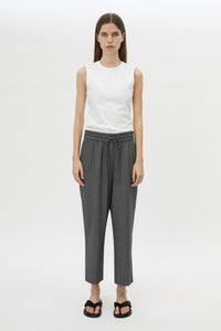 Front styled view CAMILLA AND MARC Vector Crop Pant in Charcoal Grey with soft suiting fabrication.