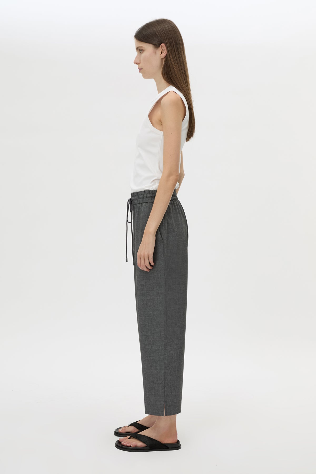 Side view CAMILLA AND MARC Vector Crop Pant in Charcoal Grey with soft suiting fabrication.