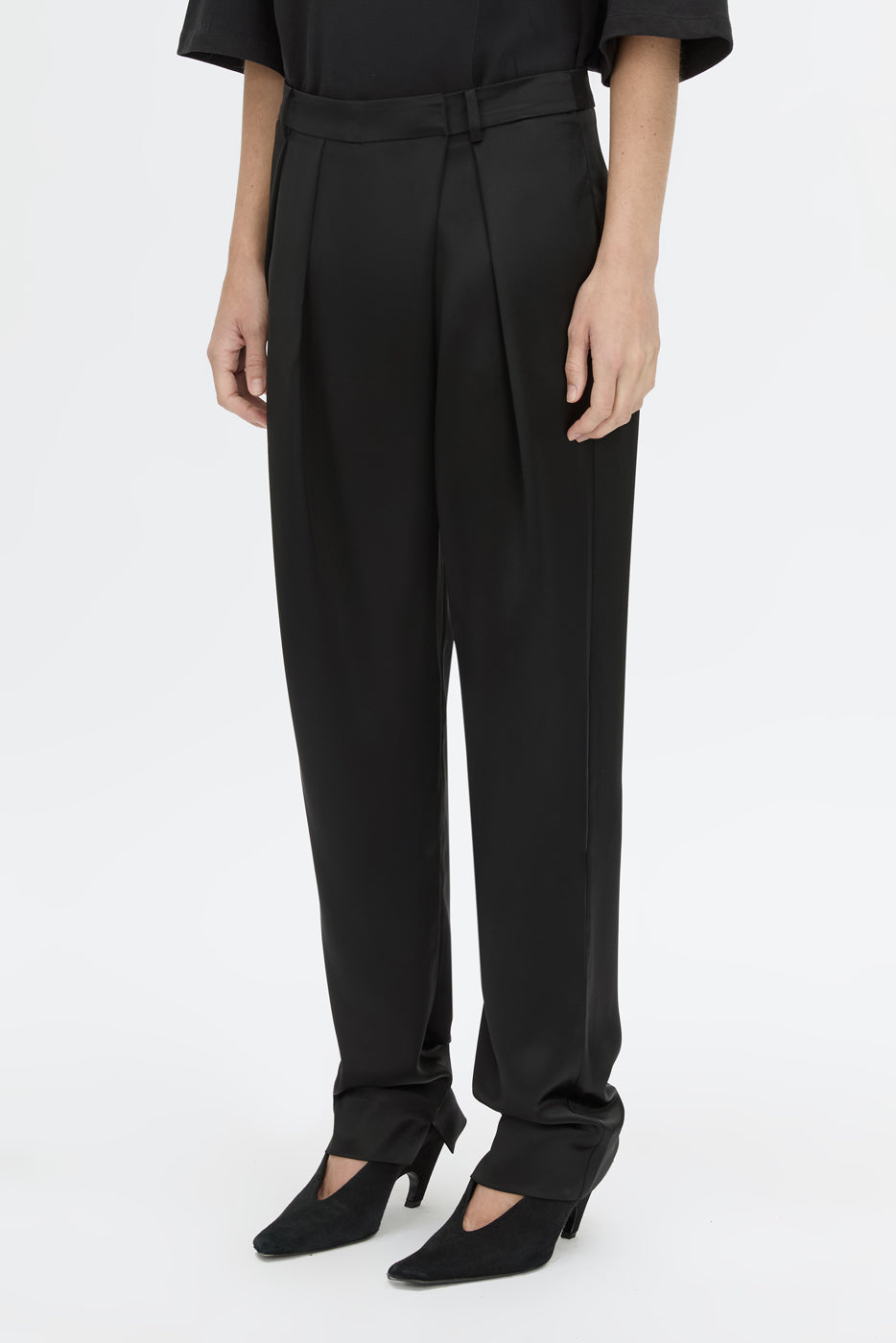 Cropped view CAMILLA AND MARC Velin Pant in black with pleated bow‑leg design.