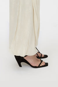 Side view CAMILLA AND MARC Wave Mule in black soft goat suede with heeled sandal design.