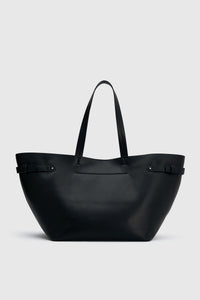 Back view CAMILLA AND MARC Willa Tote in Black with side strap and buckle detailing and magnetic button closure.