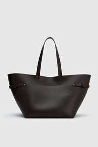 Back view CAMILLA AND MARC Willa Tote in Chocolate Brown with side strap and buckle detailing and magnetic button closure.