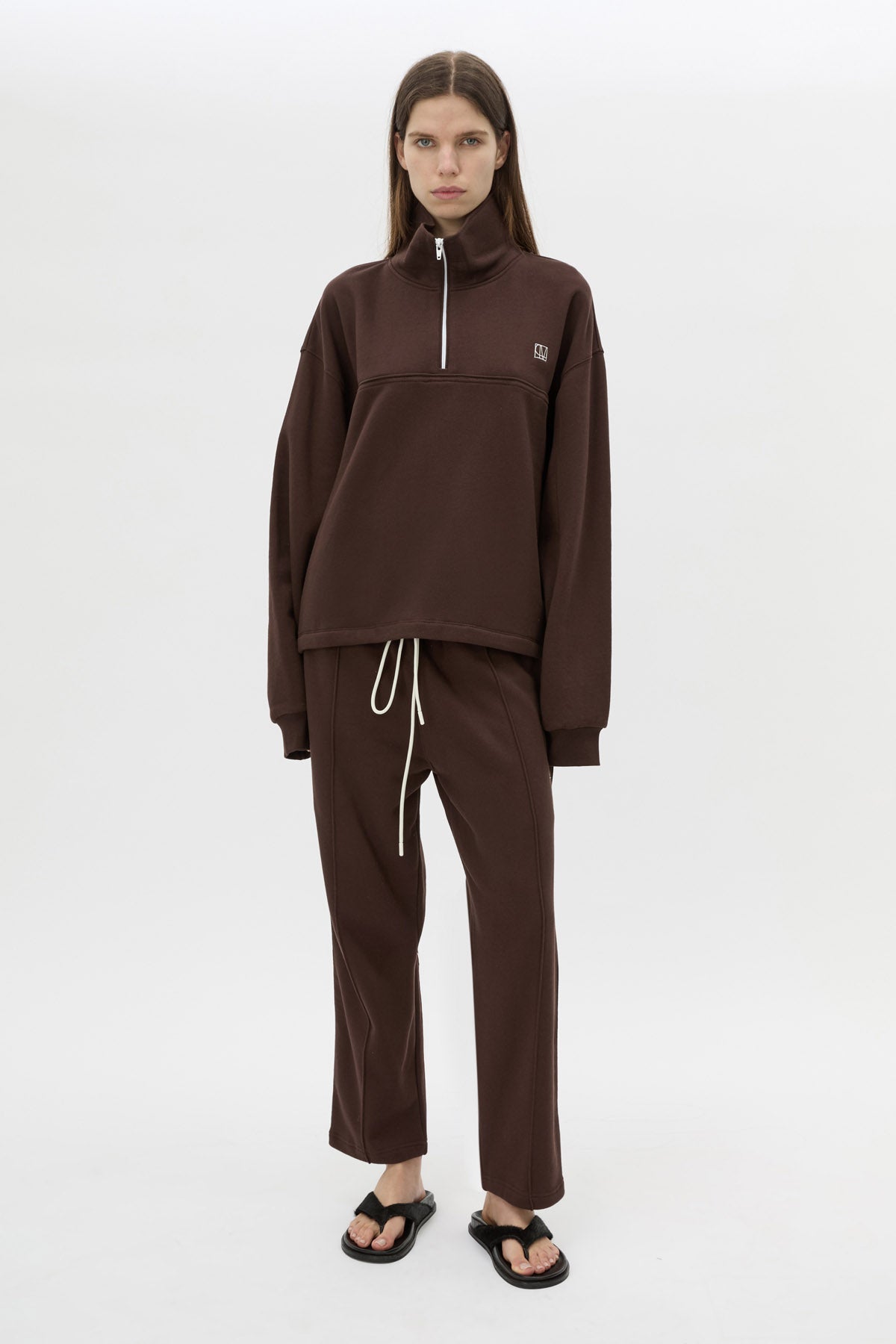 Front view CAMILLA AND MARC Zylus funnel neck pullover sweater in chocolate/white with contrast embroidered monogram.