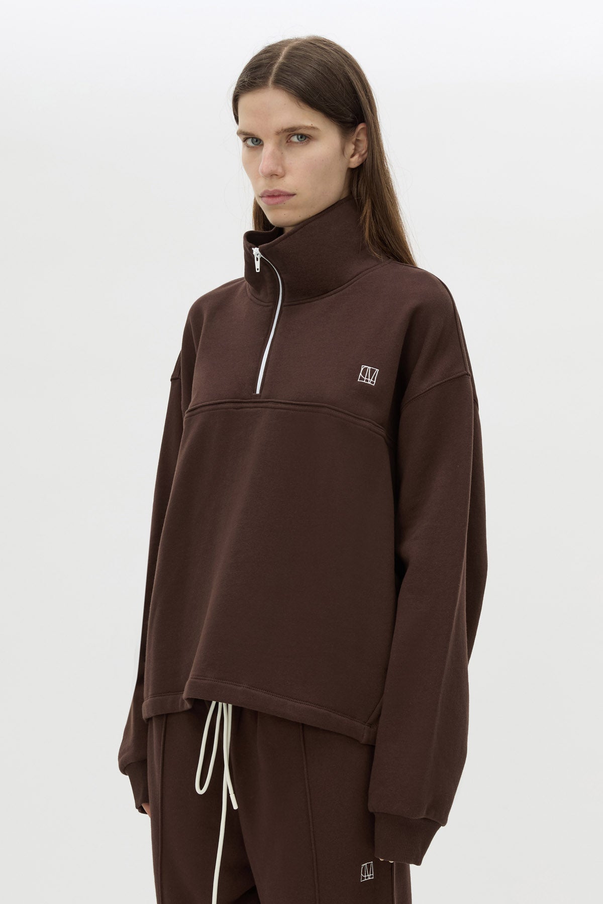 Cropped view CAMILLA AND MARC Zylus funnel neck pullover sweater in chocolate/white with contrast embroidered monogram.