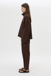 Side view CAMILLA AND MARC Zylus funnel neck pullover sweater in chocolate/white with contrast embroidered monogram.
