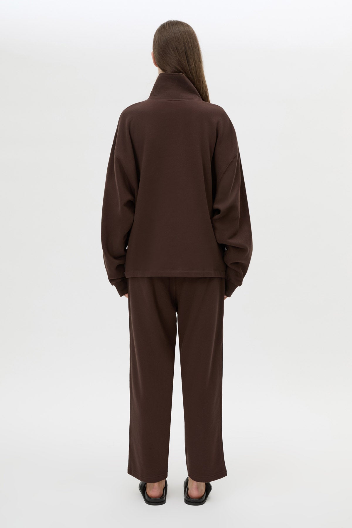 Back view CAMILLA AND MARC Zylus funnel neck pullover sweater in chocolate/white with contrast embroidered monogram.