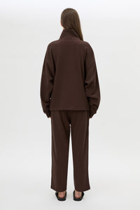 Back view CAMILLA AND MARC Zylus funnel neck pullover sweater in chocolate/white with contrast embroidered monogram.