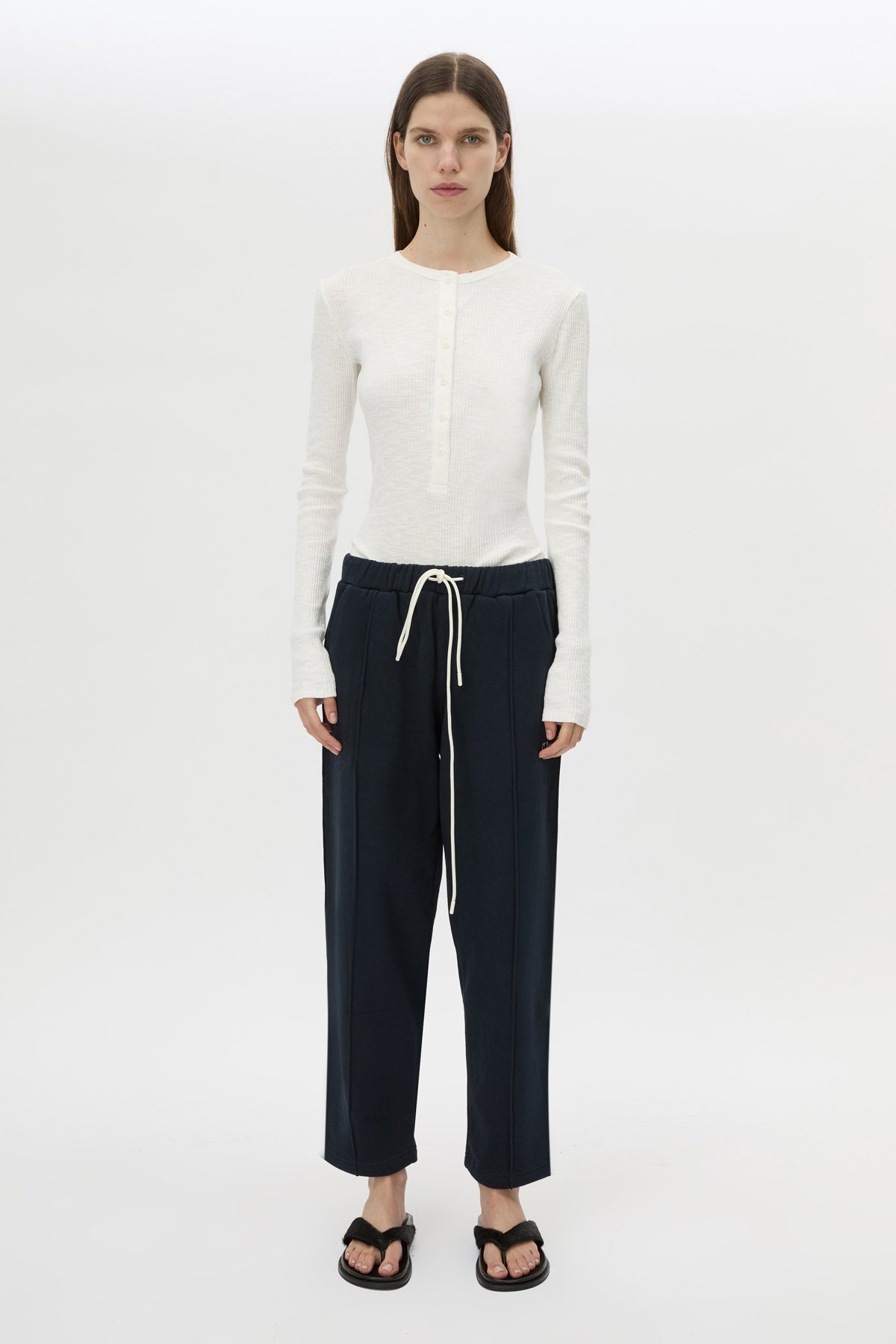 Front view CAMILLA AND MARC Zylus straight-leg tracksuit pant in navy with embroidered monogram.