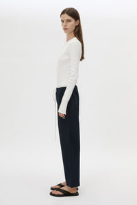 Side view CAMILLA AND MARC Zylus straight-leg tracksuit pant in navy with embroidered monogram.