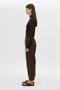 Side view CAMILLA AND MARC Zylus straight-leg tracksuit pant in chocolate with embroidered monogram.