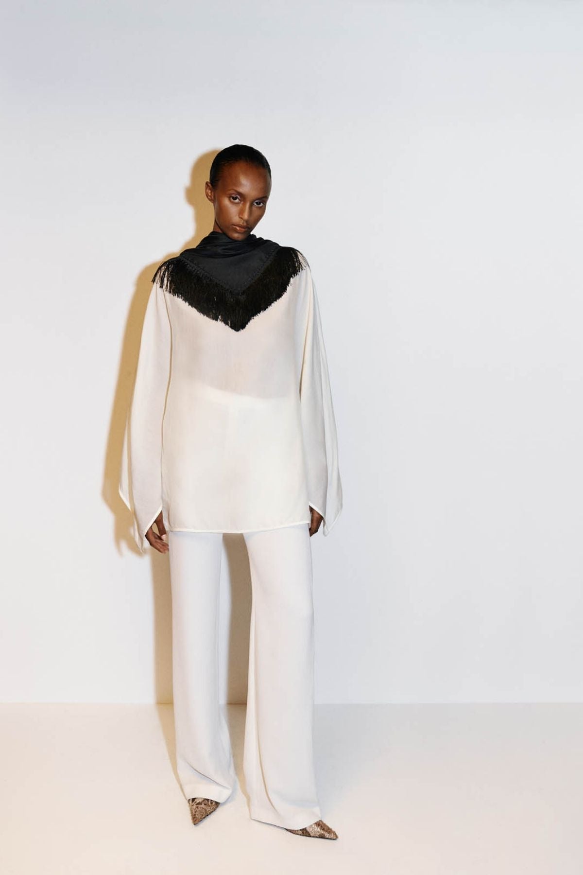 Campaign view CAMILLA AND MARC long-sleeve Rene Draped Top in cream with a boat neckline.