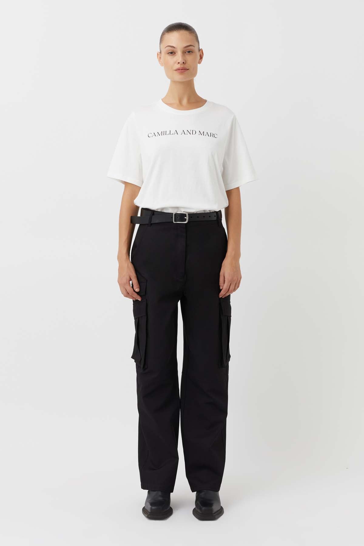CAMILLA AND MARC Asher Cotton Logo Tee in White.

The Asher Tee seamlessly blends comfort and style, making it a perfect choice for any casual occasion. This tee is crafted from premium quality cotton and promises a soft and breathable feel, ensuring all-day comfort. The relaxed fit and logo elevate this tee making it an instant wardrobe hero.